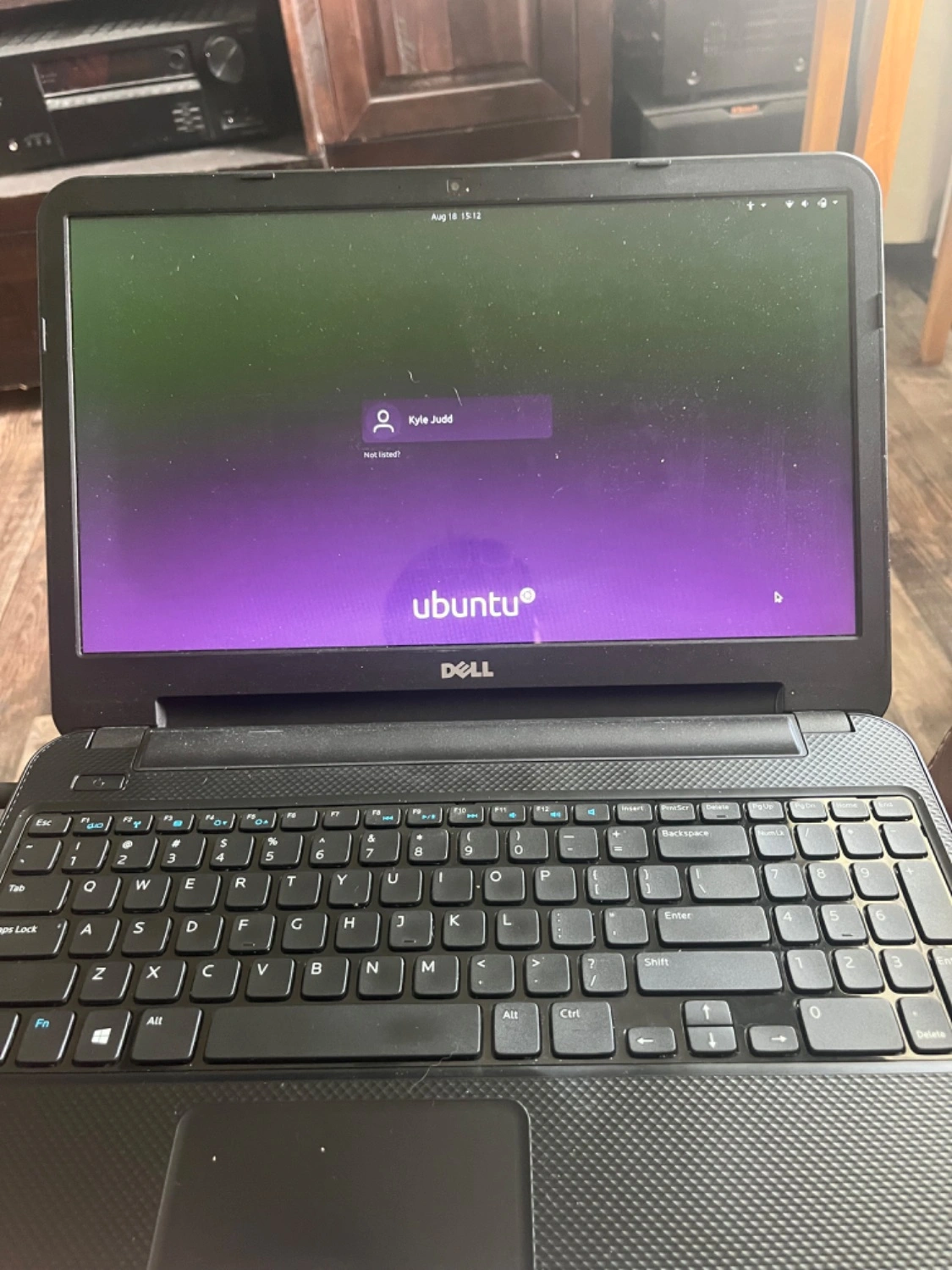 Portrait shot of a Dell laptop loaded with Ubuntu Linux.