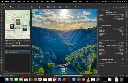 A view of digiKam's main screen, with a beautiful picture of a view in the central pane, a map indicating where the photo was taken on the left, and the file's metadata on the right.